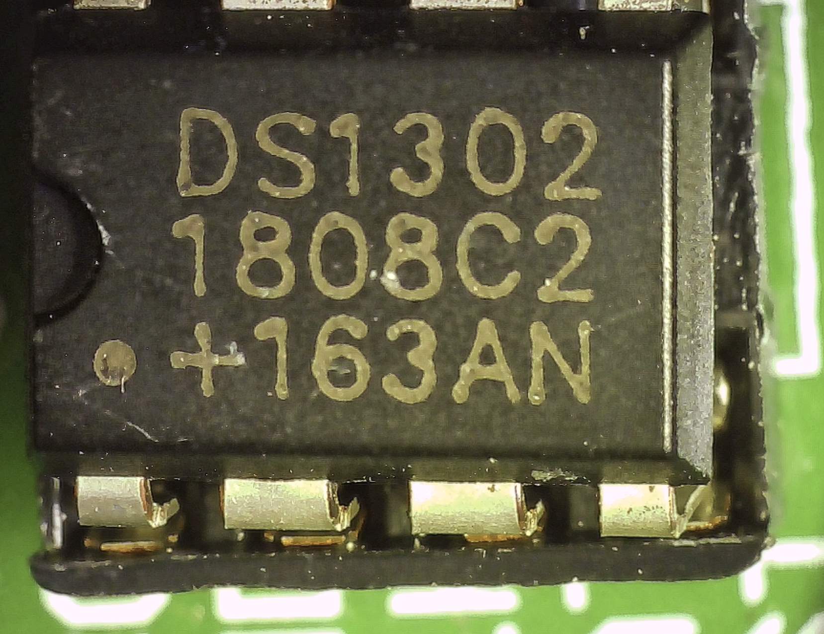 The DS1302 chip on the breakout board as seen through a digital microscope.