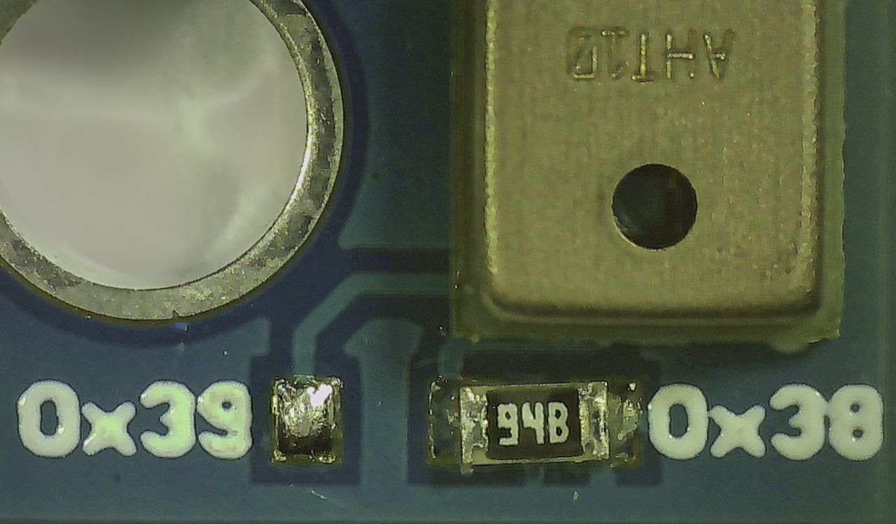 Micrograph of the AHT10 breakout board showing where the I2C address can be changed